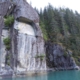A steep granite cliff plunges into the deep waters of Alaska's inside passage.